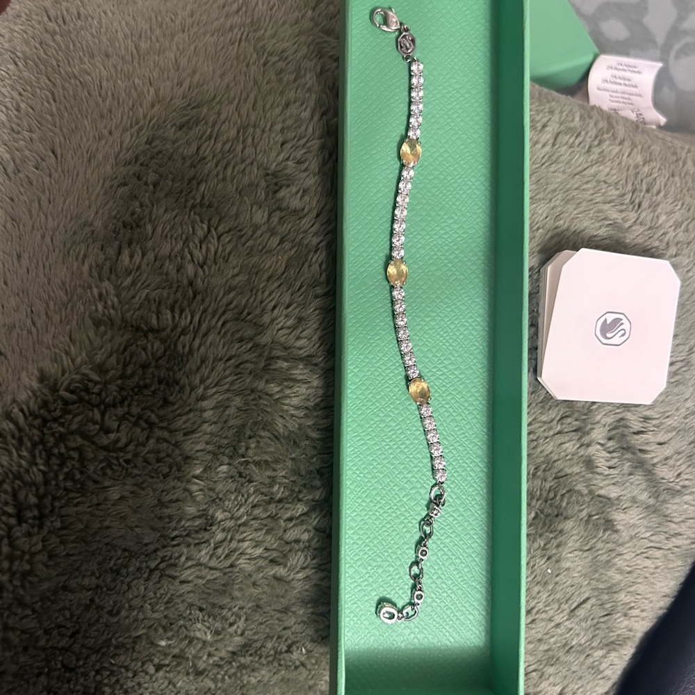 Selling a Swarovski matrix tennis bracelet mixed cuts.